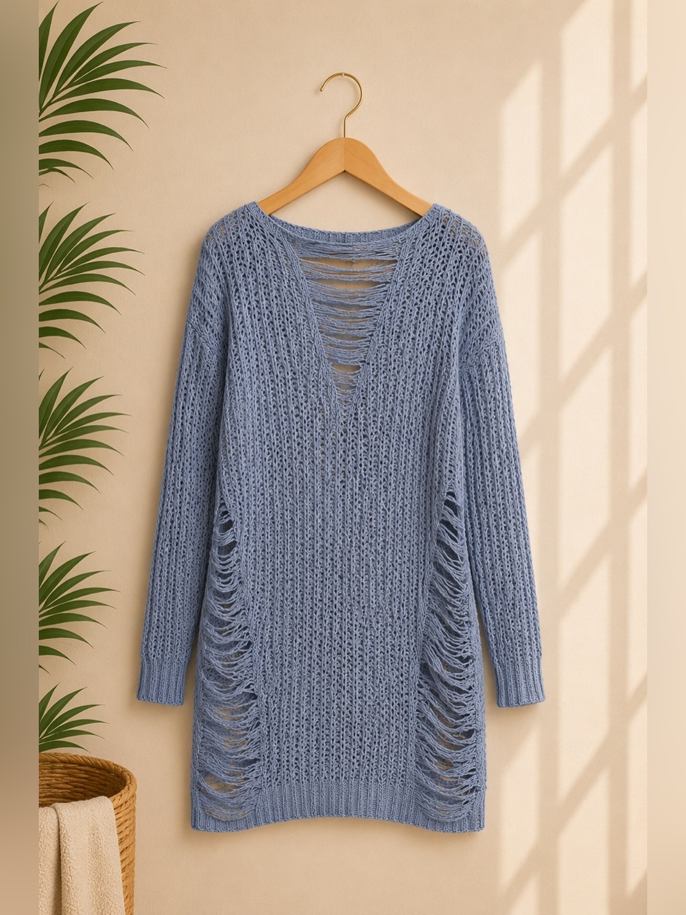 Distressed light blue sweater
